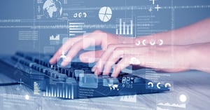typing on keyboard looking at data driven decision graphs